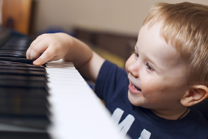 happy boy at the piano