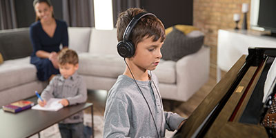 playing the piano with headphones