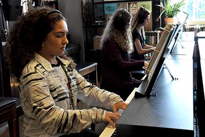 students in a group piano lab