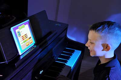 student recital with digital piano and app